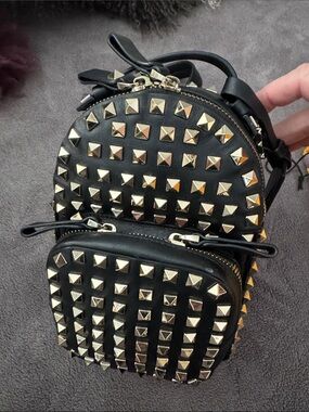 Valentino Garavani Black Leather Mini Backpack with Gold Pyramid Studs
